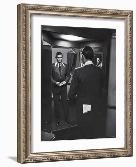 Gregory Peck Trying on Suit for His New Movie Man in the Grey Flannel Suit-Michael Rougier-Framed Premium Photographic Print