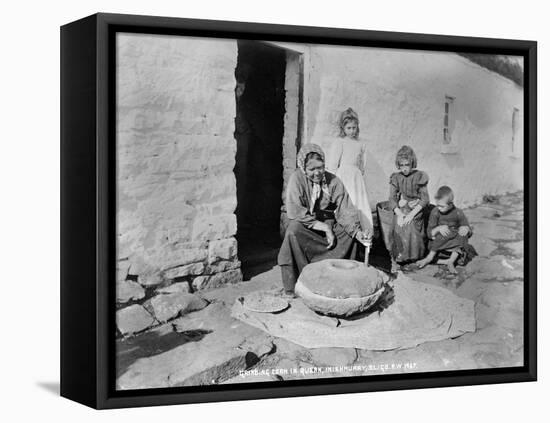 Grinding Grain in a Quern, Inishmurray, County Sligo, 1900-Robert John Welch-Framed Premier Image Canvas