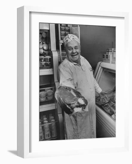 Grocer E.G. Guthart Displaying One of His Steaks-Francis Miller-Framed Photographic Print