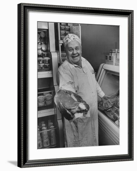 Grocer E.G. Guthart Displaying One of His Steaks-Francis Miller-Framed Photographic Print