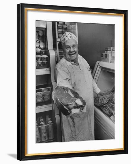 Grocer E.G. Guthart Displaying One of His Steaks-Francis Miller-Framed Photographic Print