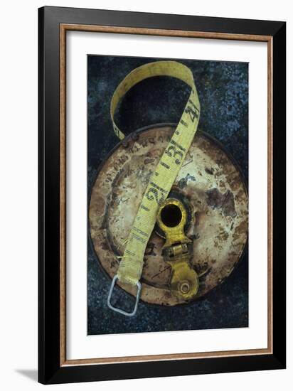 Groundsmans Measuring Tape in Well Worn Metal Case with Brass Winding Handle Lying-Den Reader-Framed Photographic Print