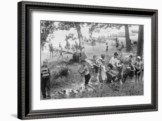 Group of Boys Carry Loaves of Bread from Wagons Near Beach Front in Woods.-null-Framed Art Print