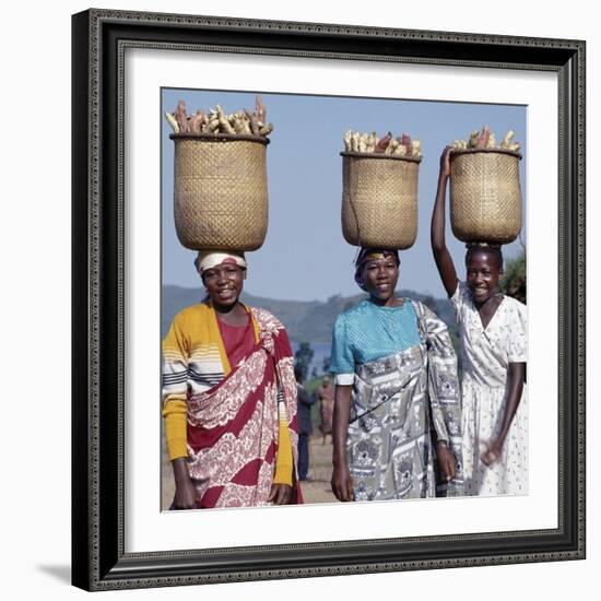 Group of Cheerful Women Carry Sweet Potatoes to Market in Traditional Split-Bamboo Baskets-Nigel Pavitt-Framed Photographic Print