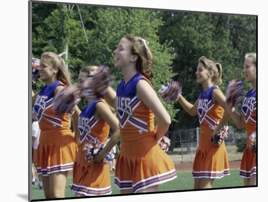 Group of Cheerleaders Cheering in a Field-null-Mounted Photographic Print