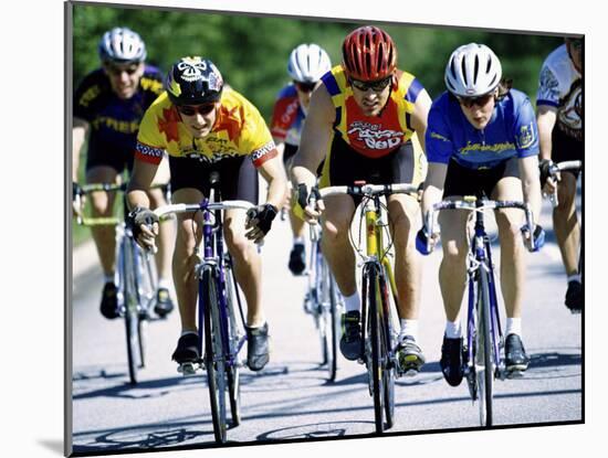 Group of Cyclists Riding Bicycles-null-Mounted Photographic Print