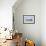 Group of Grey partridge huddled for warmth in snowy field-Edwin Giesbers-Framed Photographic Print displayed on a wall