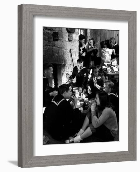 Group of Sailors and Young Ladies Sitting around a Fire Roasting Hot Dogs and Drinking Coke-Nina Leen-Framed Photographic Print