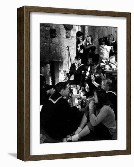 Group of Sailors and Young Ladies Sitting around a Fire Roasting Hot Dogs and Drinking Coke-Nina Leen-Framed Photographic Print