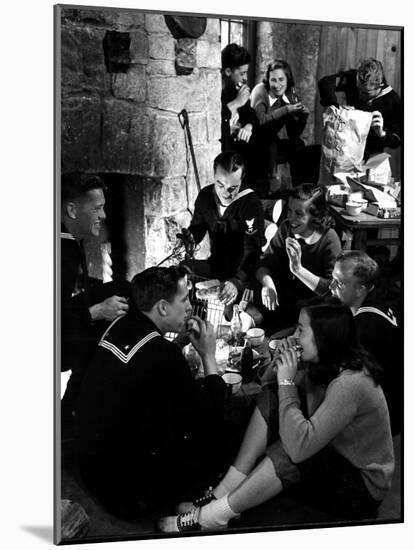 Group of Sailors and Young Ladies Sitting around a Fire Roasting Hot Dogs and Drinking Coke-Nina Leen-Mounted Photographic Print