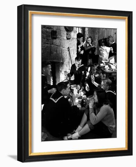 Group of Sailors and Young Ladies Sitting around a Fire Roasting Hot Dogs and Drinking Coke-Nina Leen-Framed Photographic Print