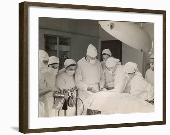 Group of Student Nurses in Theatre Observing a Surgeon Performing an Operation-null-Framed Photographic Print