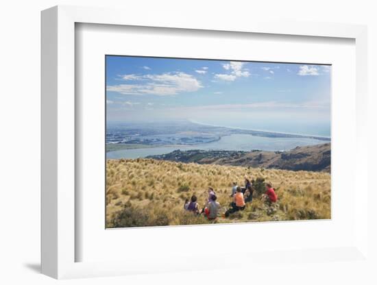 Group of young people enjoying a picnic on the Port Hills, Christchurch, Canterbury, South Island, -Ruth Tomlinson-Framed Photographic Print