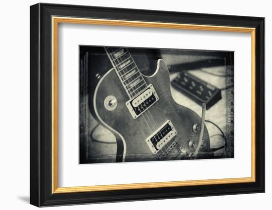 Guitar with Loudspeaker Boxes in the Background, Selective Focus, Polaroid Style-Bernd Wittelsbach-Framed Photographic Print