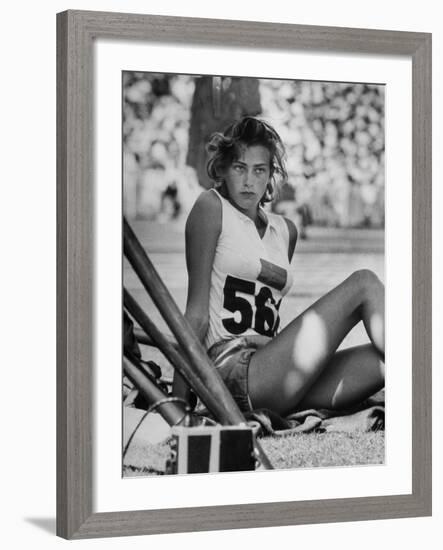 Gunhild Larking, Sweden's Entry for High Jump, Nervously Awaiting Turn to Compete at Olympic Games-George Silk-Framed Premium Photographic Print