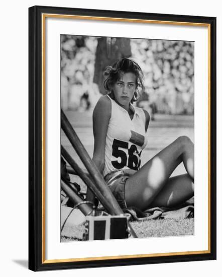 Gunhild Larking, Sweden's Entry for High Jump, Nervously Awaiting Turn to Compete at Olympic Games-George Silk-Framed Premium Photographic Print