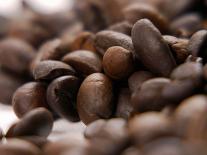 Coffee Beans Falling from Someone's Hand into a Sack-Gustavo Andrade-Photographic Print