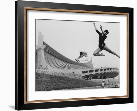 Gymnasts Outside the New Olympic Building in Japan-Larry Burrows-Framed Photographic Print