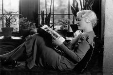 1930s BLOND WOMAN SITTING BY WINDOW READING MAGAZINE PROFILE VIEW PLANTS IN BACKGROUND WINDOW SEAT-H. Armstrong Roberts-Photographic Print