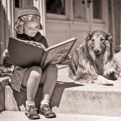 1930s ENGROSSED LITTLE GIRL OUTDOOR READING BIG BOOK SITTING NEXT TO ...
