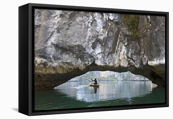 Ha Long Bay, Vietnam. View of kayaker through limestone arch.-Yvette Cardozo-Framed Premier Image Canvas