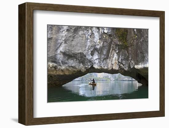 Ha Long Bay, Vietnam. View of kayaker through limestone arch.-Yvette Cardozo-Framed Photographic Print