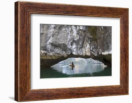 Ha Long Bay, Vietnam. View of kayaker through limestone arch.-Yvette Cardozo-Framed Photographic Print