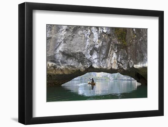 Ha Long Bay, Vietnam. View of kayaker through limestone arch.-Yvette Cardozo-Framed Photographic Print