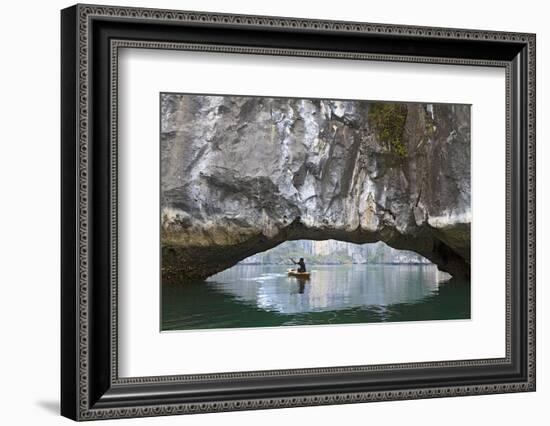 Ha Long Bay, Vietnam. View of kayaker through limestone arch.-Yvette Cardozo-Framed Photographic Print