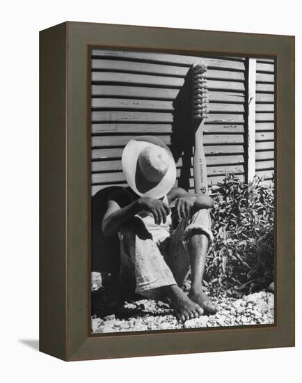 Haitian Native Engaged in a Siesta Next to Giant American Toothbrush Ad He Totes Around the Streets-Rex Hardy Jr.-Framed Premier Image Canvas