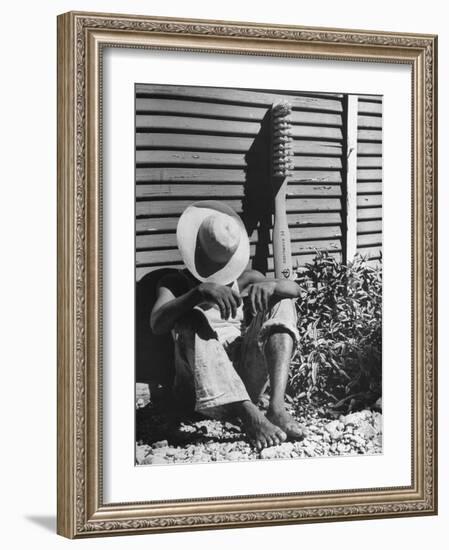 Haitian Native Engaged in a Siesta Next to Giant American Toothbrush Ad He Totes Around the Streets-Rex Hardy Jr.-Framed Photographic Print