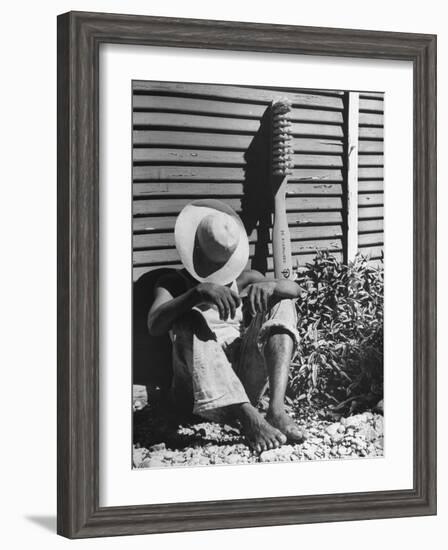 Haitian Native Engaged in a Siesta Next to Giant American Toothbrush Ad He Totes Around the Streets-Rex Hardy Jr.-Framed Photographic Print