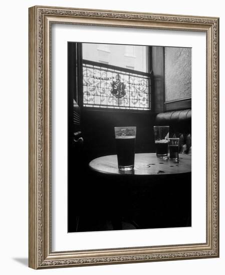 Half Empty Glasses of Beer Left on Table in the Blue Lion Pub in Dublin-Gjon Mili-Framed Photographic Print