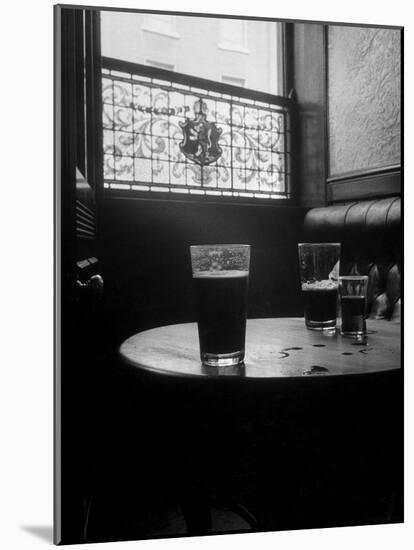 Half Empty Glasses of Beer Left on Table in the Blue Lion Pub in Dublin-Gjon Mili-Mounted Photographic Print