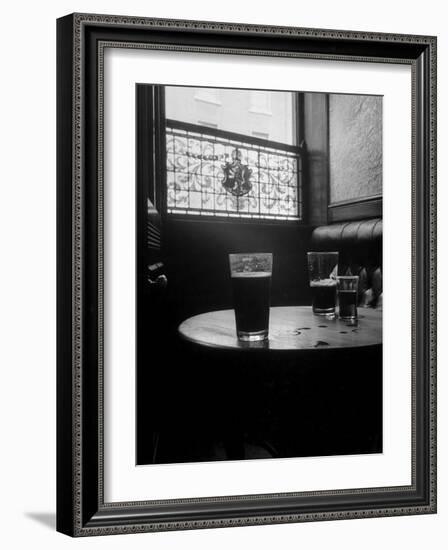 Half Empty Glasses of Beer Left on Table in the Blue Lion Pub in Dublin-Gjon Mili-Framed Photographic Print