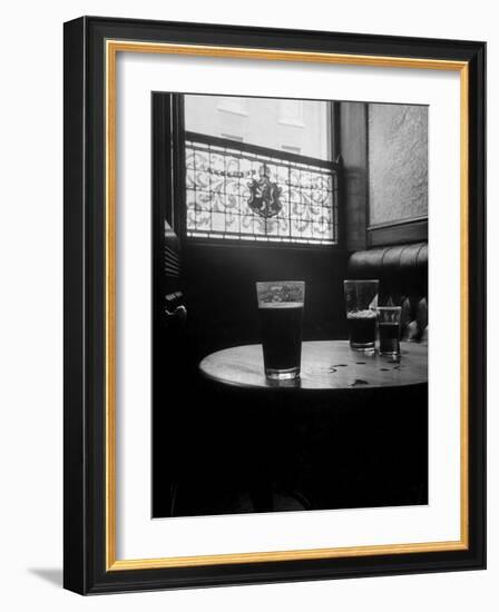 Half Empty Glasses of Beer Left on Table in the Blue Lion Pub in Dublin-Gjon Mili-Framed Photographic Print