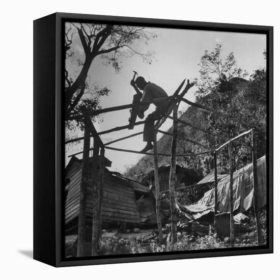 Hammer and Courage Start a New Home Out of Tree Limbs and Scrap Lumber For Fisherman Simms Balti-George Silk-Framed Premier Image Canvas