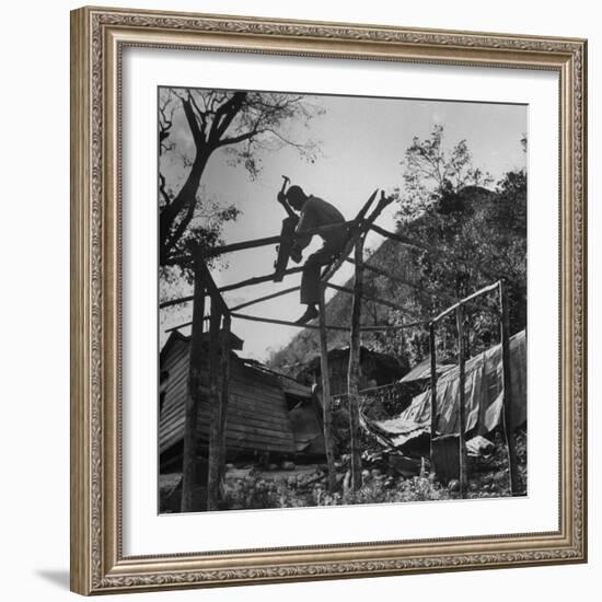 Hammer and Courage Start a New Home Out of Tree Limbs and Scrap Lumber For Fisherman Simms Balti-George Silk-Framed Photographic Print