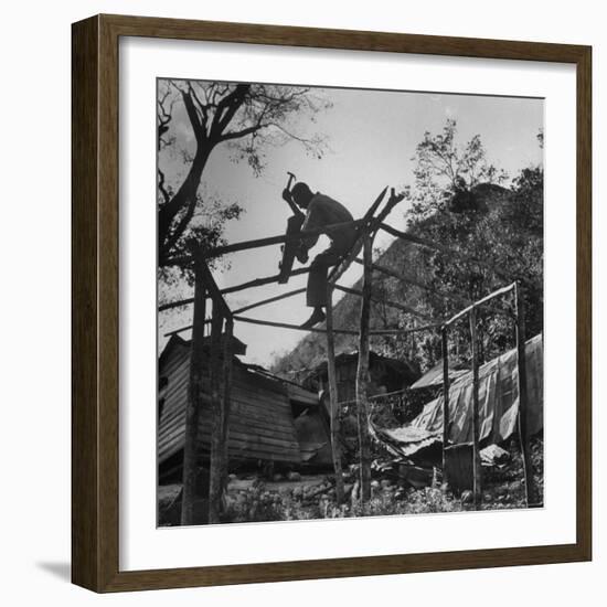 Hammer and Courage Start a New Home Out of Tree Limbs and Scrap Lumber For Fisherman Simms Balti-George Silk-Framed Photographic Print