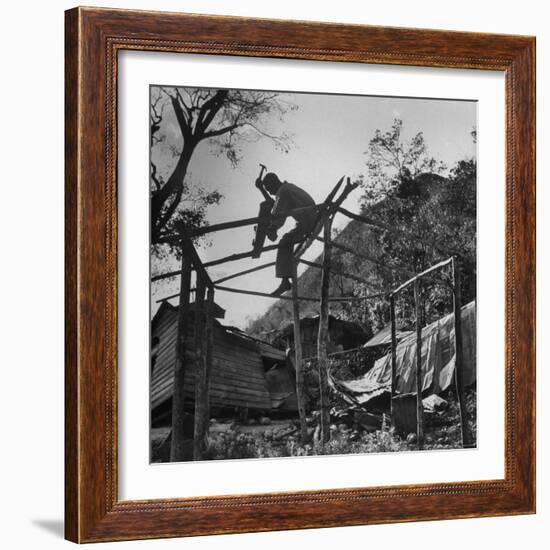 Hammer and Courage Start a New Home Out of Tree Limbs and Scrap Lumber For Fisherman Simms Balti-George Silk-Framed Photographic Print