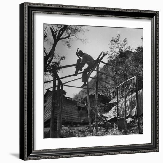 Hammer and Courage Start a New Home Out of Tree Limbs and Scrap Lumber For Fisherman Simms Balti-George Silk-Framed Photographic Print