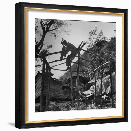 Hammer and Courage Start a New Home Out of Tree Limbs and Scrap Lumber For Fisherman Simms Balti-George Silk-Framed Photographic Print