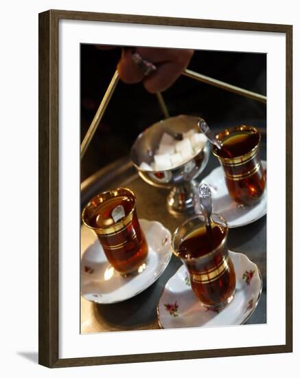 Hand Holding a Tray with Turkish Tea, Istanbul, Turkey, Europe-Levy Yadid-Framed Photographic Print