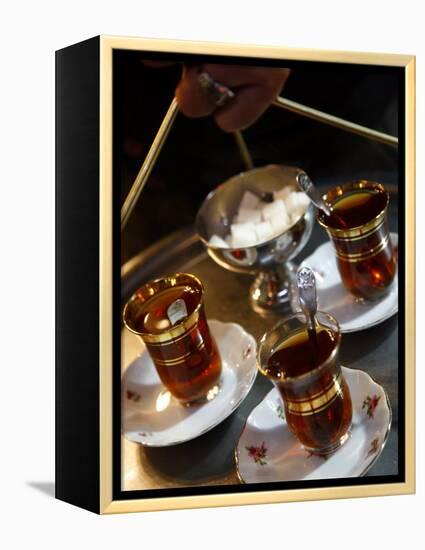 Hand Holding a Tray with Turkish Tea, Istanbul, Turkey, Europe-Levy Yadid-Framed Premier Image Canvas