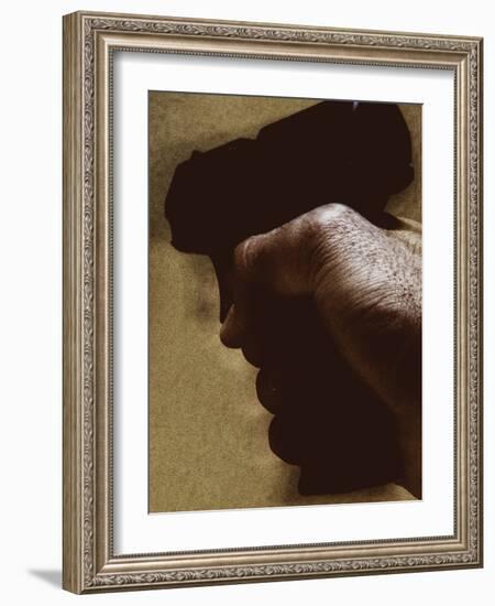 Hand Holding Gun-Torsten Richter-Framed Photographic Print