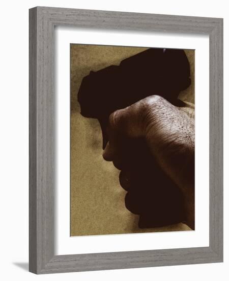 Hand Holding Gun-Torsten Richter-Framed Photographic Print