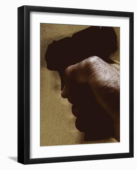 Hand Holding Gun-Torsten Richter-Framed Photographic Print