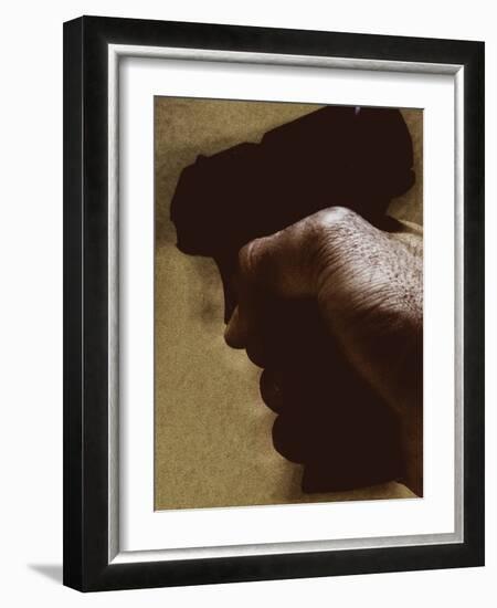 Hand Holding Gun-Torsten Richter-Framed Photographic Print