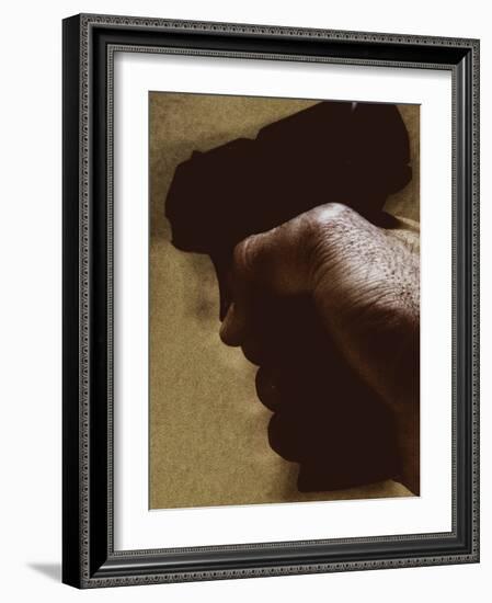 Hand Holding Gun-Torsten Richter-Framed Photographic Print