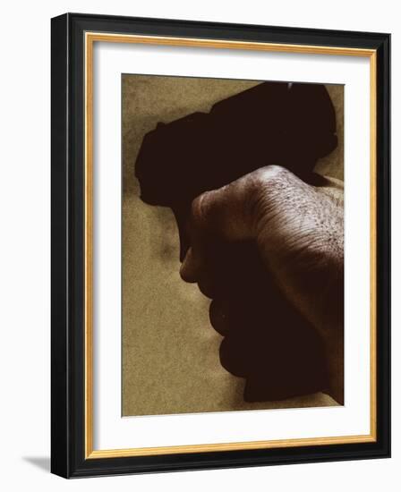 Hand Holding Gun-Torsten Richter-Framed Photographic Print